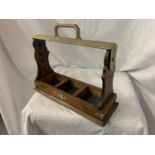 A VINTAGE OAK 'THE TANTALUS' BOTTLE CARRIER WITH BRASS DETAIL