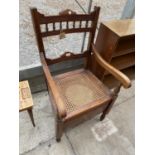 A VICTORIAN COMMODE ARMCHAIR