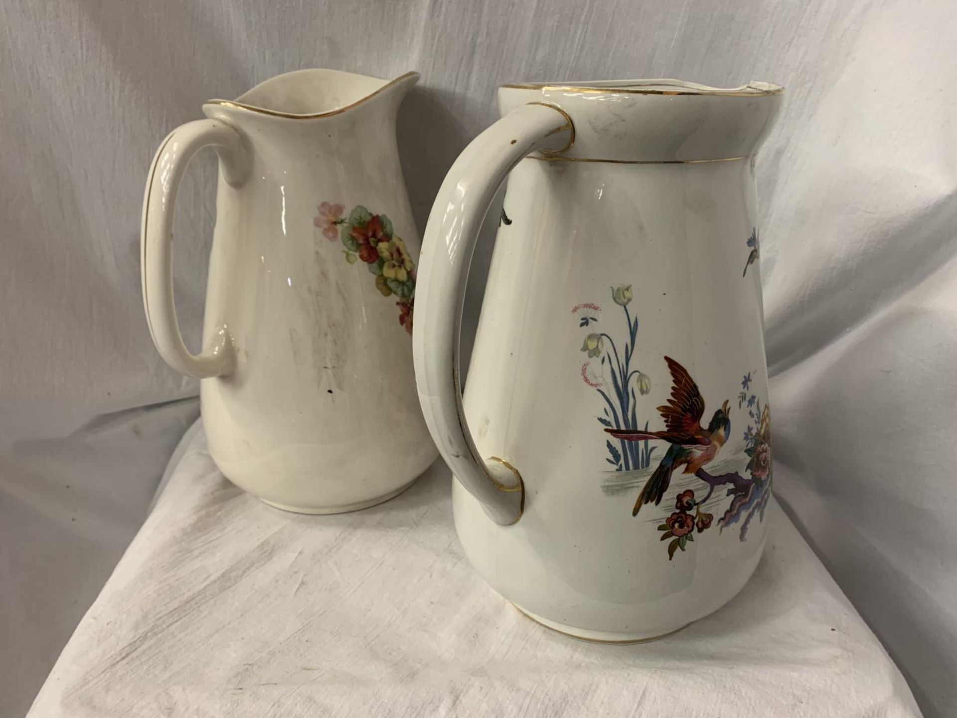 TWO LARGE CERAMIC JUGS ONE WITH FLORAL DECORATION, THE OTHER PEARL POTTERY WITH AVIAN DESIGN H: 31CM - Image 3 of 3