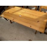 A MODERN PINE COFFEE TABLE WITH LIFT UP LID TO REVEAL STORAGE AREA 41" X 17.5"