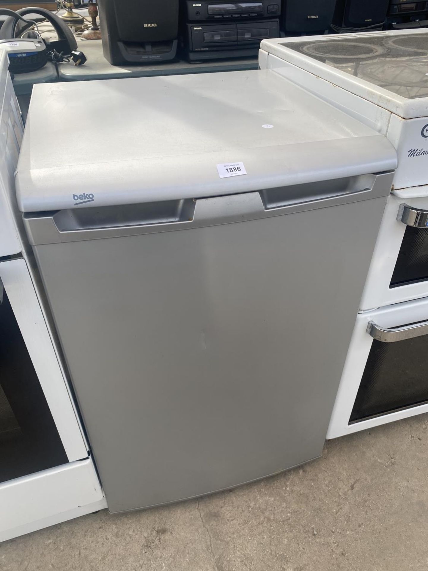 A SILVER BEKO UNDER COUNTER FRIDGE BELIEVED IN WORKING ORDER BUT NO WARRANTY