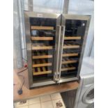 A CHROME AND BLACK WINE FRIDGE BELIEVED IN WORKING ORDER BUT NO WARRANTY