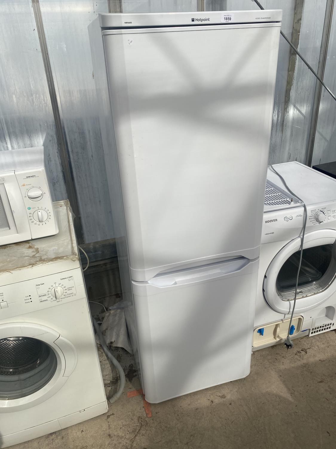 A WHITE HOTPOINT UPRIGHT FRIDGE FREEZER BELIEVED IN WORKING ORDER BUT NO WARRANTY