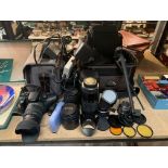 A CANON DS126071 DIGITAL CAMERA WITH VARIOUS LENSES, FILTERS, A TRIPOD AND CARRY CASES
