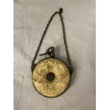 A HEAVILY CARVED GUNPOWDER FLASK WITH WHITE METAL DETAIL AND CHAIN ATTACHED DIA: 10.5CM