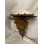 A CARVED WOODEN WALL SCONCE DEPICTING AN EAGLE AND A THISTLE 30.5CM X 35CM