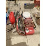 AN ASSORTMENT OF GARDEN TOOLS TO INCLUDE BOW SAWS, EDGING SHEARS NEW SPADE HANDLES AND FUEL CANS ETC