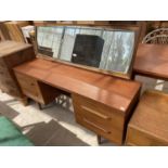 A RETRO TEAK 'WILLIAM LAWRENCE' DRESSING TABLE ENCLOSING FOUR DRAWERS, 60" WIDE