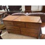 A MODERN OAK EFFECT CHEST OF SEVEN DRAWERS, 51" WIDE