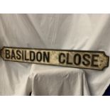 A CAST METAL STREET SIGN 'BASILDON CLOSE' 110CM X 15CM
