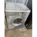 A SILVER INDESIT WASHING MACHINE BELIEVED IN WORKING ORDER BUT NO WARRANTY