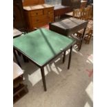 A FOLDING CARD TABLE WITH GREEN BAIZE TOP AND OAK DINNER TROLLEY