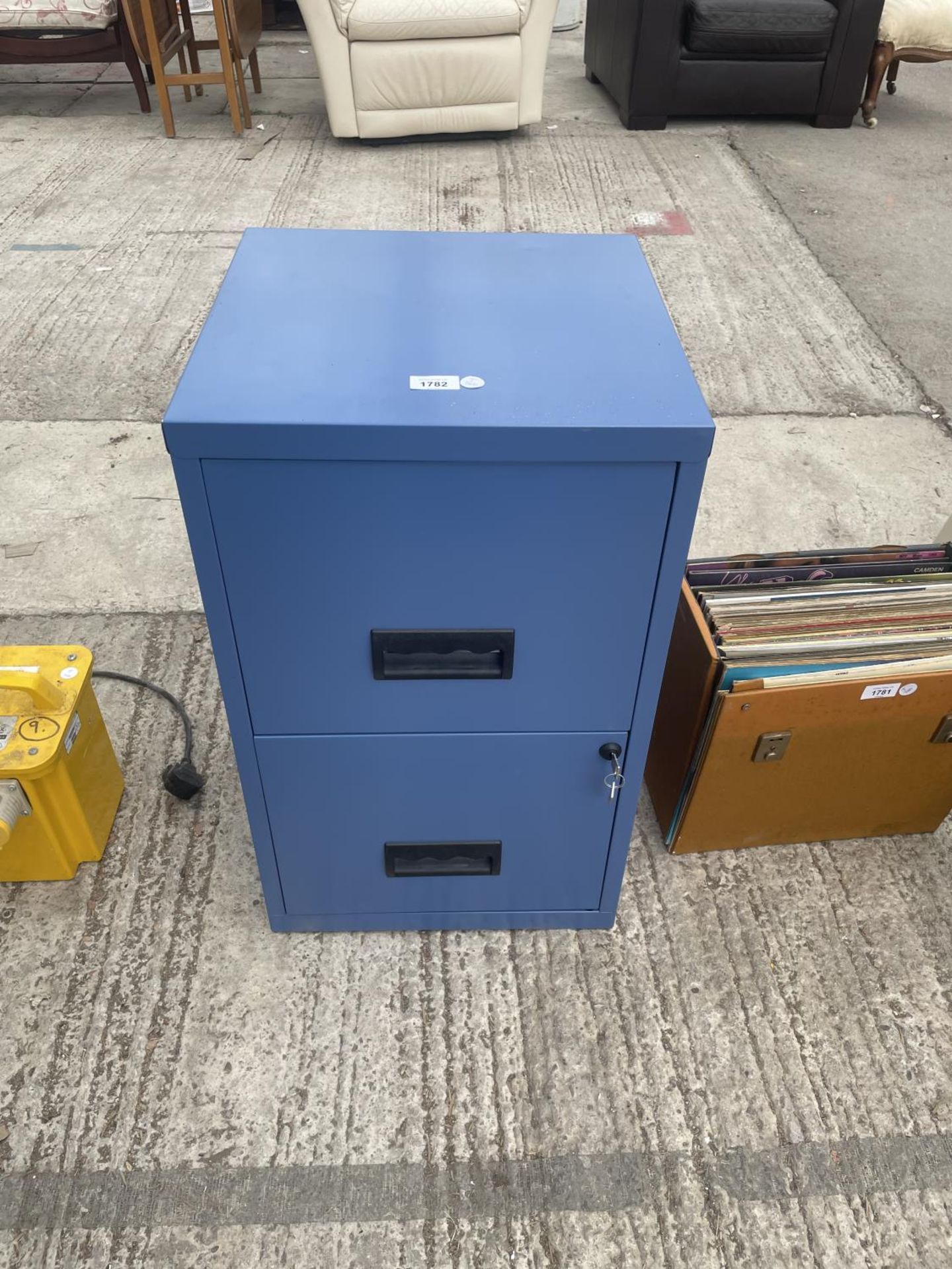 A METAL TWO DRAWER FILING CABINET WITH KEY