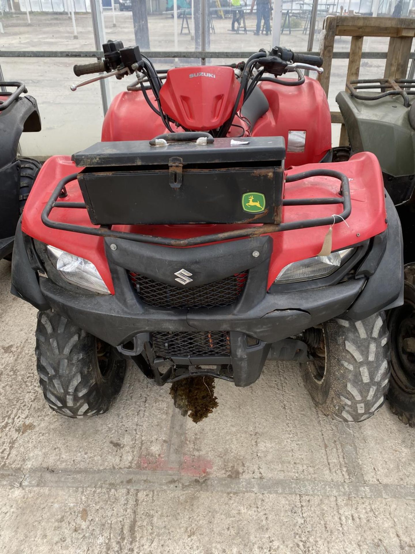 A 2014 SUZUKI KING QUAD, 500 CC WITH POWER STEERING - SEE VIDEO OF VEHICLE STARTING AND RUNNING AT