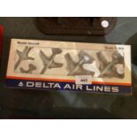 A RARE BOX OF FIVE DELTA AIRLINES DIE CAST PLANES