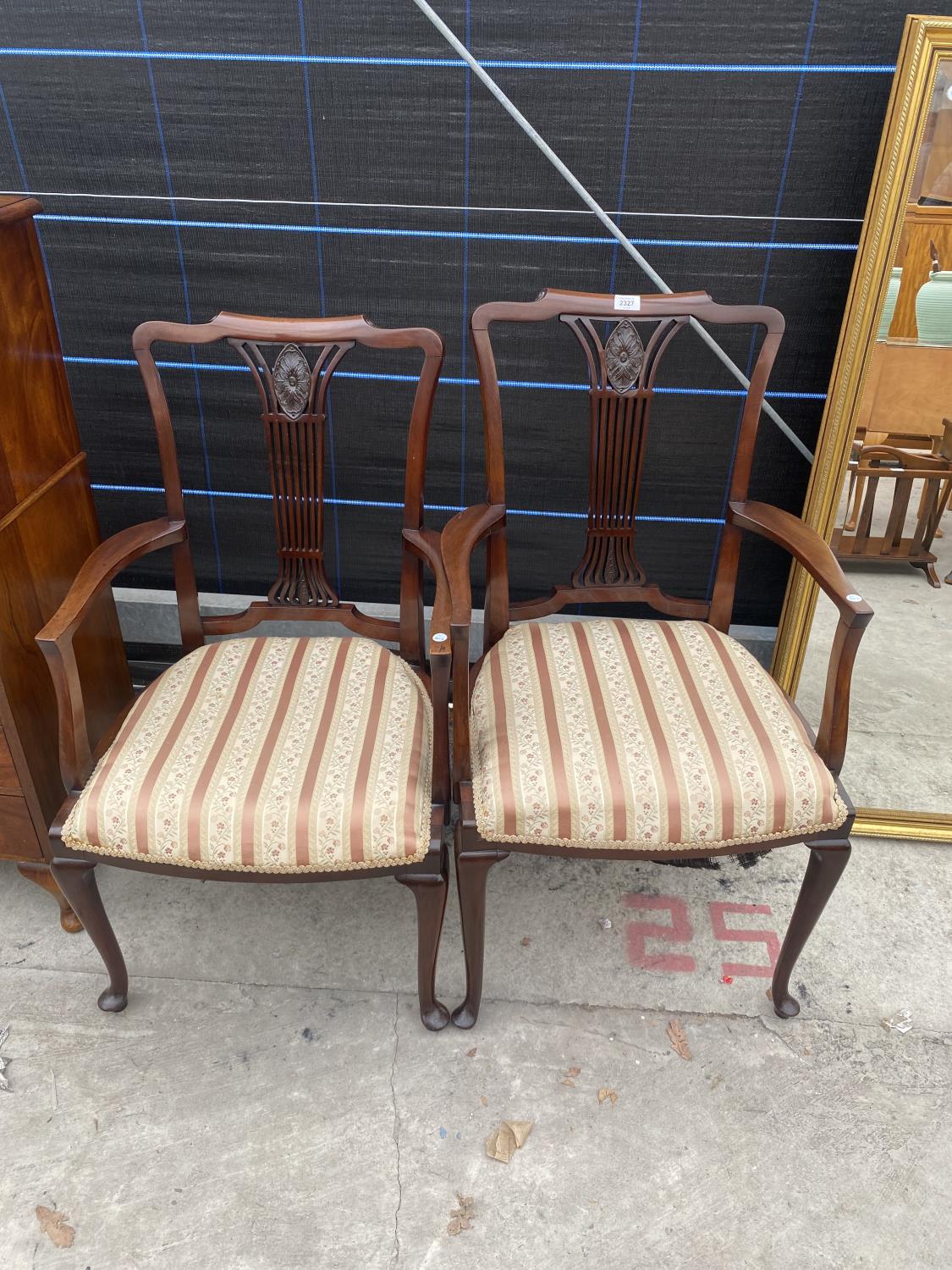 A PAIR OF EDWARDIAN MAHOGANY CARVER CHAIRS WITH PIERCED SPLAT BACKS, ON CABRIOLE LEGS