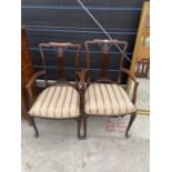 A PAIR OF EDWARDIAN MAHOGANY CARVER CHAIRS WITH PIERCED SPLAT BACKS, ON CABRIOLE LEGS