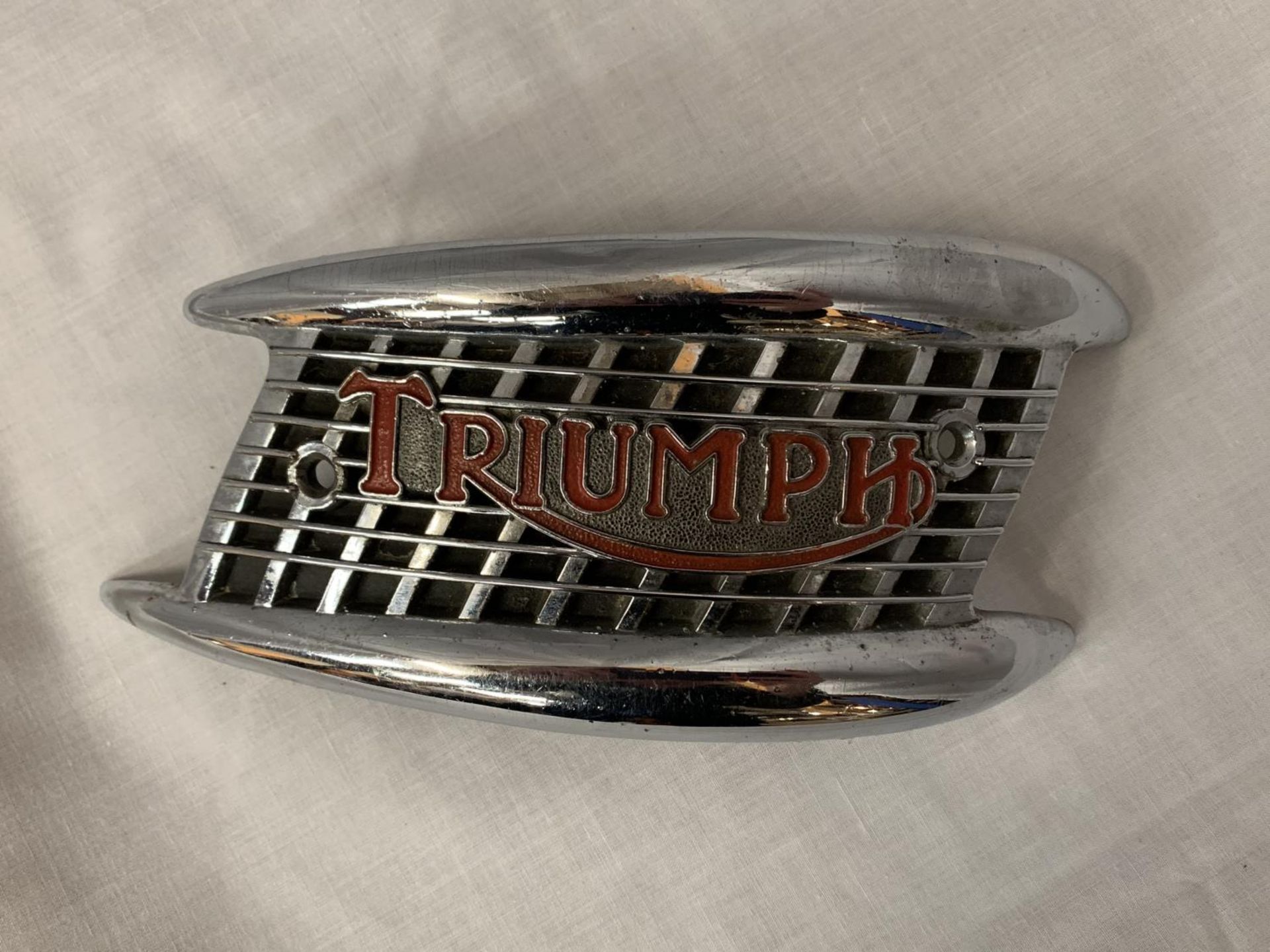 A VINTAGE TRIUMPH MOTORBIKE FUEL TANK BADGE