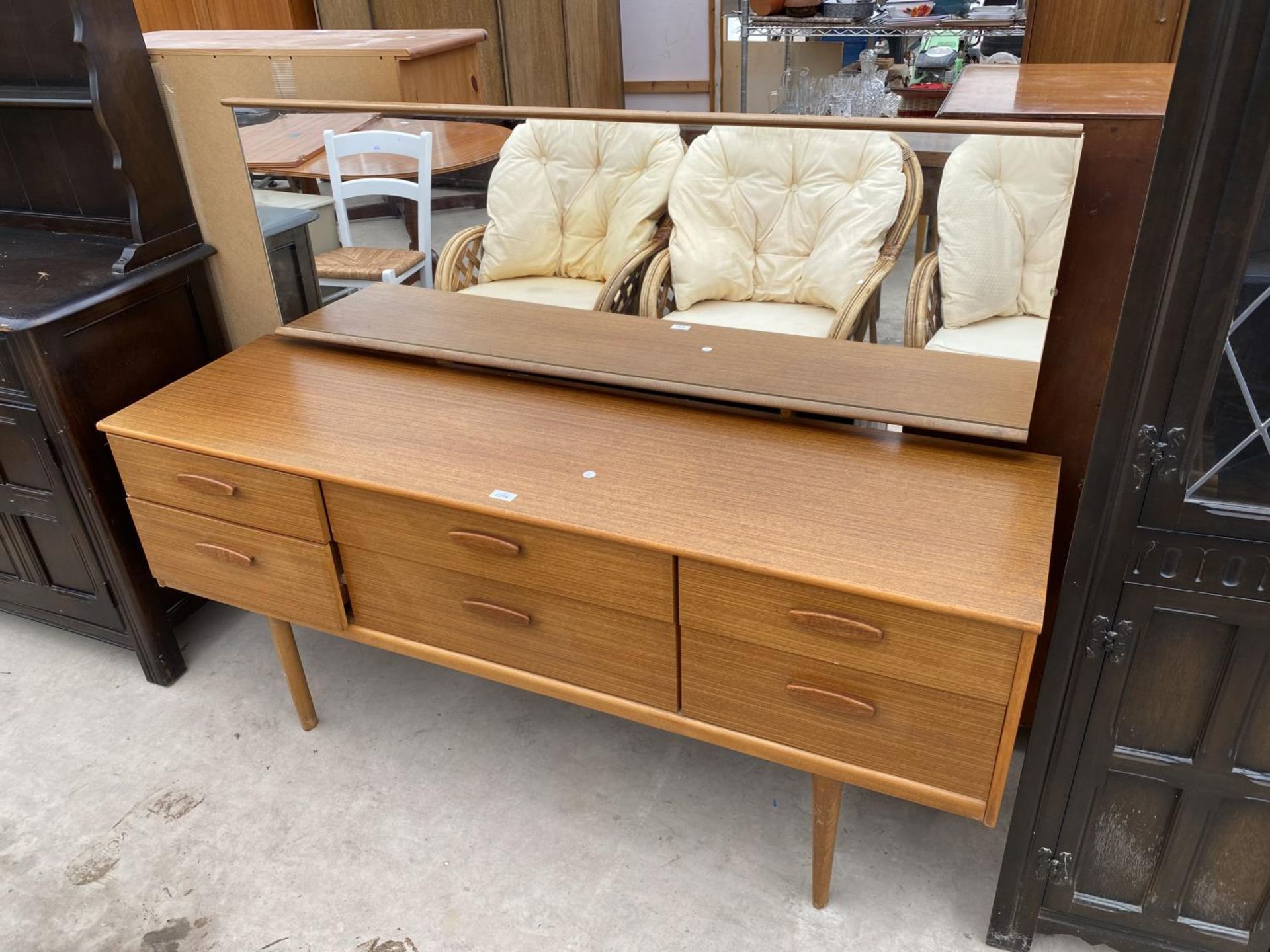 A RETRO TEAK AUSTINSUITE DRESSING TABLE WITH SIX DRAWERS, 61" WIDE