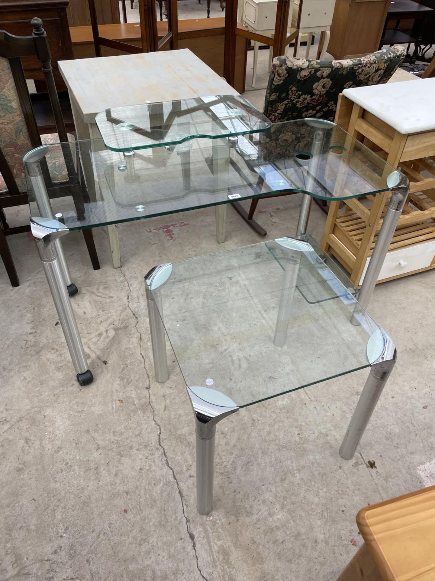 A MODERN GLASS COMPUTER TABLE AND SQUARE TABLE