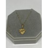 A 9 CARAT GOLD NECKLACE WITH A HEART SHAPED PENDANT
