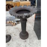 A DECORATIVE CAST METAL BIRD BATH