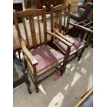 A PAIR OF EARLY 20TH CENTURY OAK JACOBEAN STYLE ELBOW CHAIRS WITH BARLEYTWIST FRONT STRETCHERS