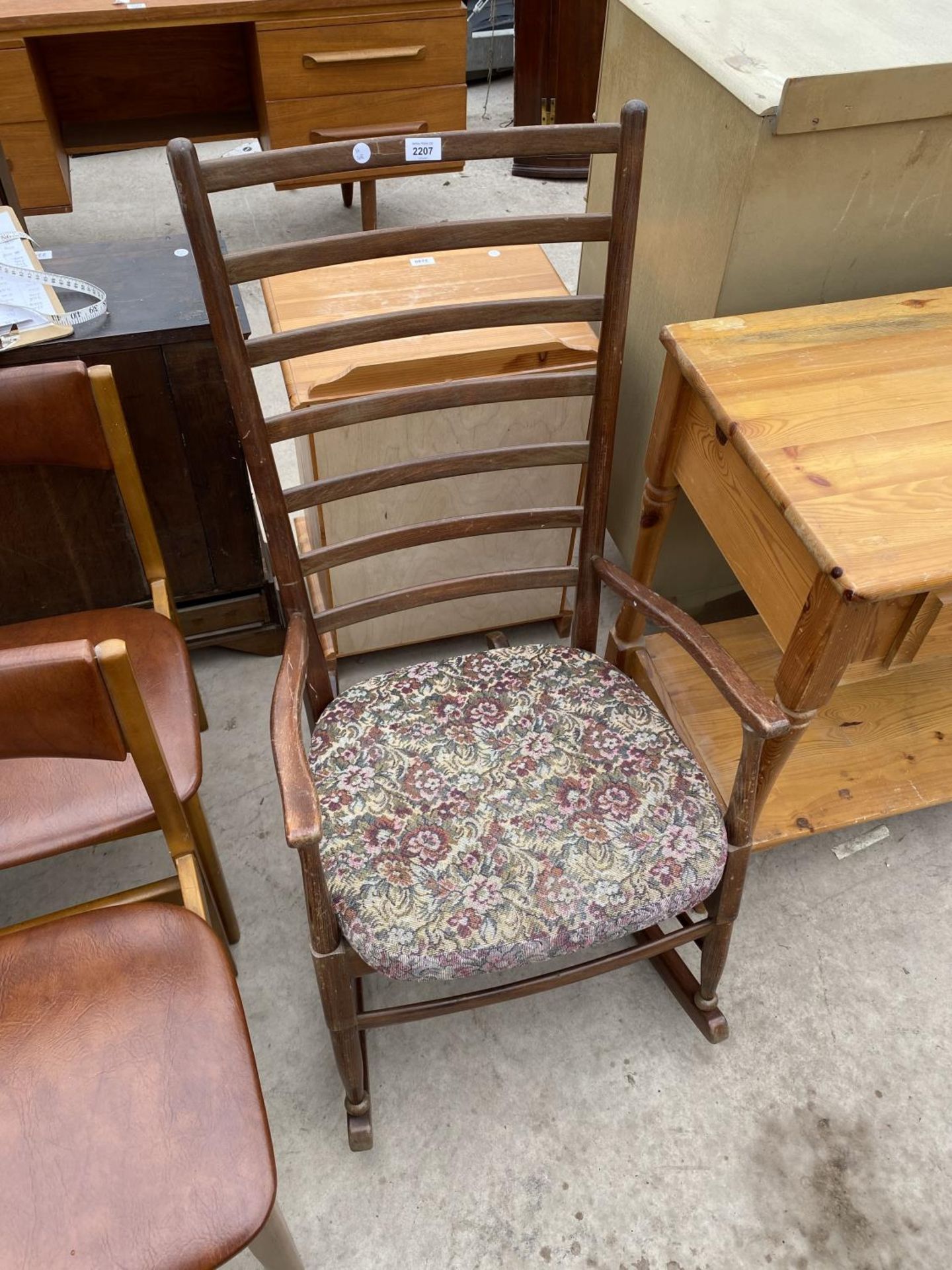 A MODERN LADDERBACK ROCKING CHAIR