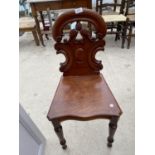 A VICTORIAN MAHOGANY HALL CHAIR ON TURNED AND FLUTED LEGS