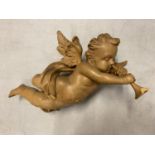 A CARVED WOODEN WALL CHERUB