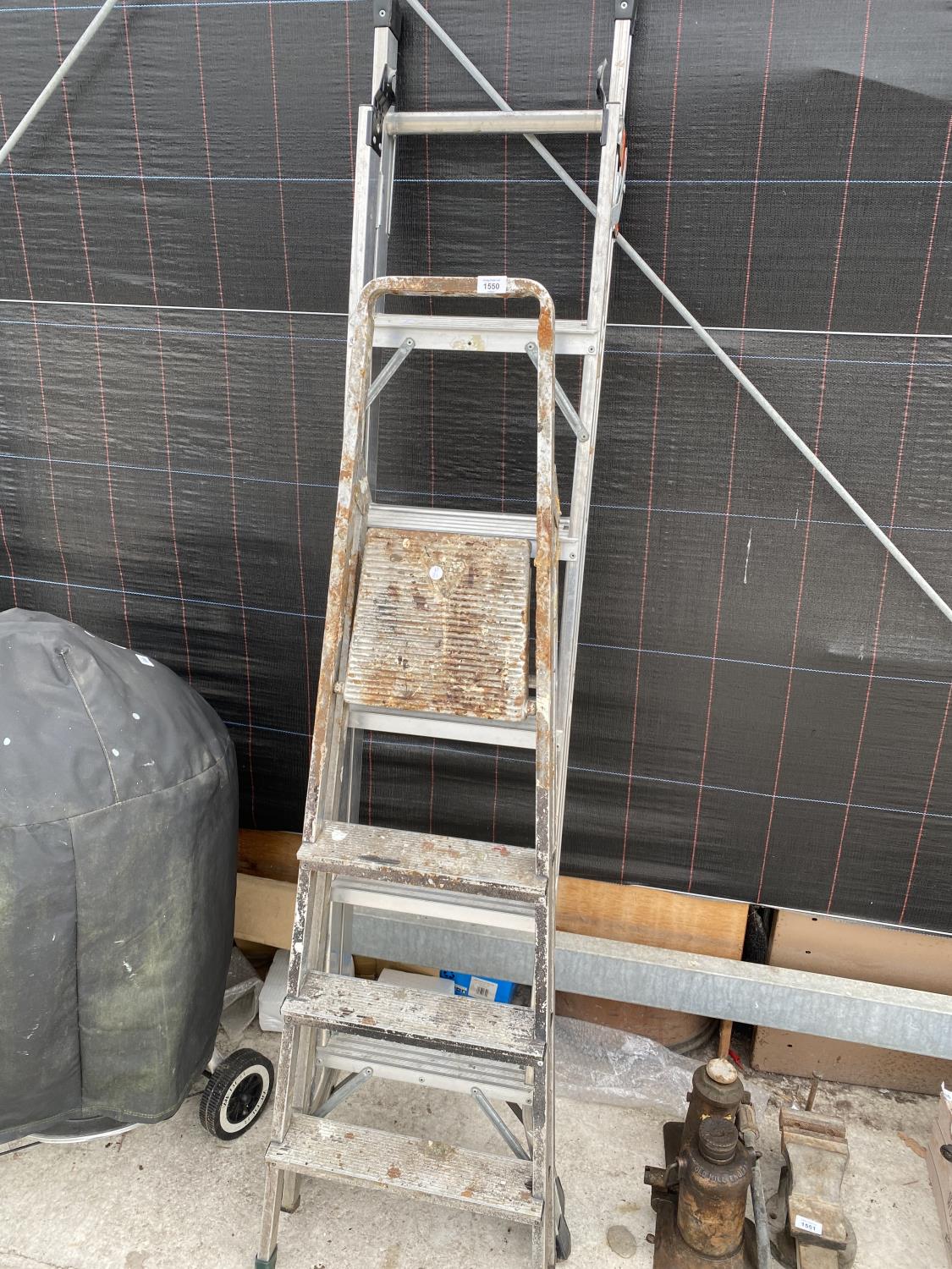 A THREE RUNG METAL STEP LADDER AND A FIVE RUNG ALLUMINIUM STEP LADDER