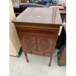 AN EDWARDIAN MAHOGANY AND INLAID COCTAIL CABINET IN THE FORM OF A GRAMOPHONE CABINET, BEARING MAKERS