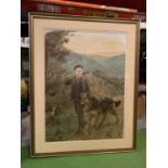 A GILT FRAMED PRINT DEPICTING A BOY WITH DOG