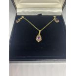 A 9 CARAT GOLD AND AMETHYST NECKLACE AND EARRING SET IN A PRESENTATION BOX