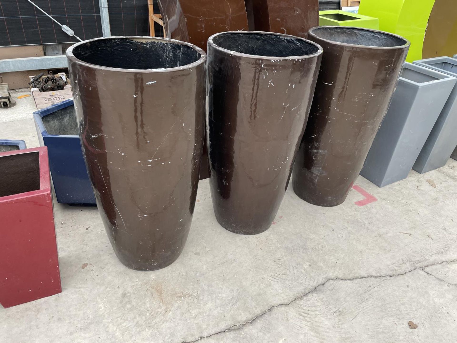 THREE ROUND BROWN FIBRE GLASS PLANTERS (H:93CM)