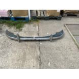A CHROME CAR BUMPER BELIEVED TO BE FROM A MORRIS MINOR
