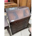 A MAHOGANY BUREAU WITH FALL FRONT, FOUR DRAWERS AND RED LEATHER WRITING SURFACE
