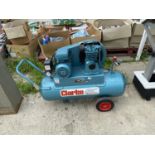 A CLARKE AIR INDUSTRIAL COMPRESSOR BELIEVED WORKING ORDER BUT NO WARRANTY