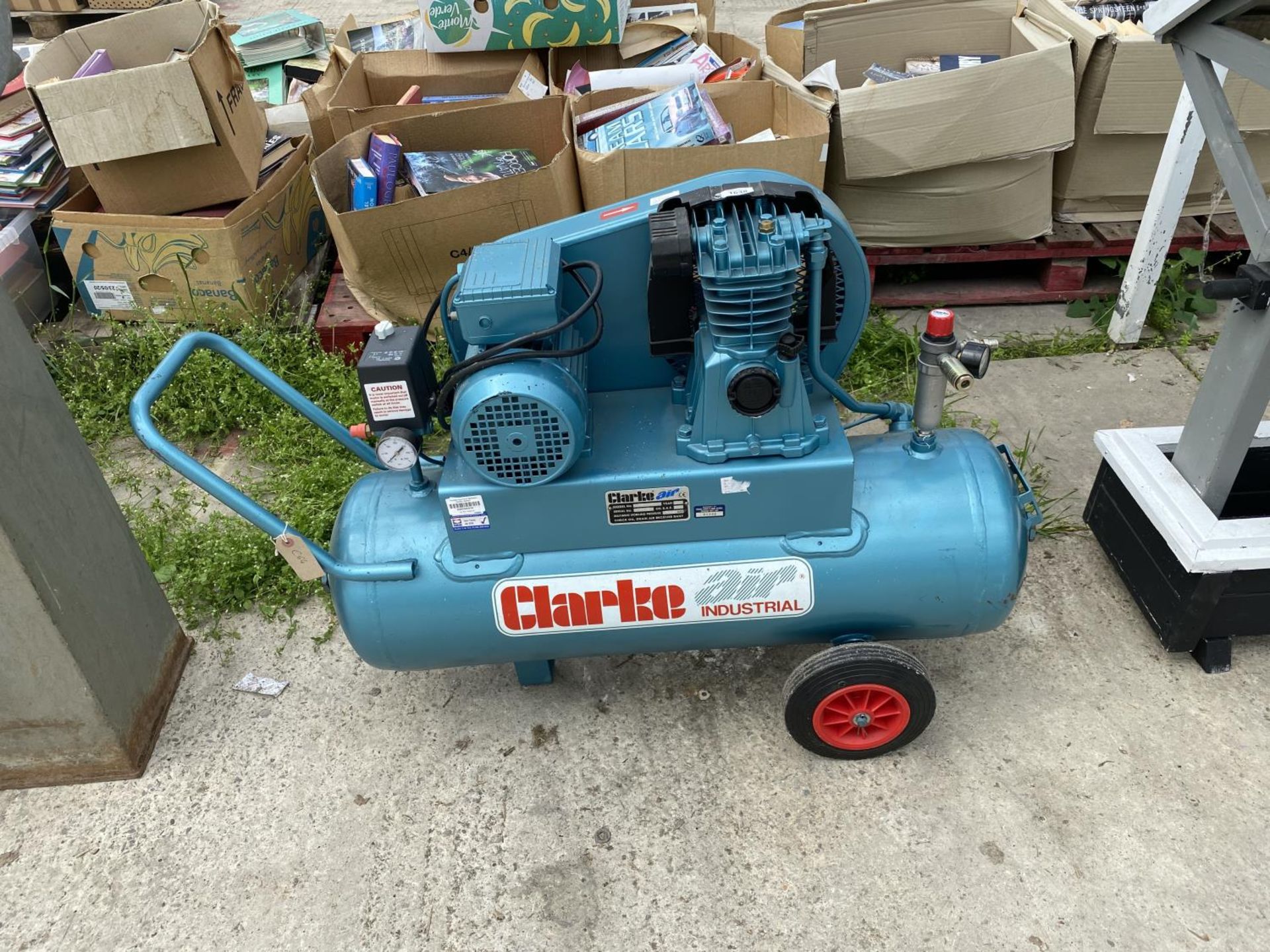 A CLARKE AIR INDUSTRIAL COMPRESSOR BELIEVED WORKING ORDER BUT NO WARRANTY