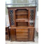 A MODERN STAINED PINE DRESSER WITH CUPBOARDS AND DRAWERS TO THE BASE, GLAZED AND LEADED UPPER