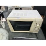 A WHITE MICROWAVE OVEN