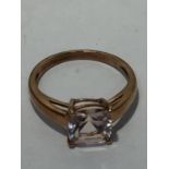 A 9 CARAT GOLD RING WITH A CUSHION CUT MORGANITE STONE