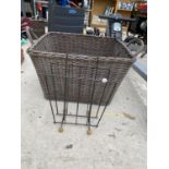 A LARGE WICKER LOG BASKET AND A FURTHER METAL MAGAZINE RACK