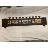 A VICTORIAN ORNATE WOODEN TEN PHOTO FRAME PANEL