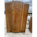 AN OAK SINGLE DOOR WARDROBE