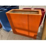 A TALL ORANGE RECTANGULAR FIBRE GLASS PLANTER (H:90CM W:90CM)