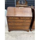 A GEORGE III OAK AND CROSSBANDED BUREAU WITH TWO SHORT AND THREE GRADUATED DRAWERS ON BRACKET FEET