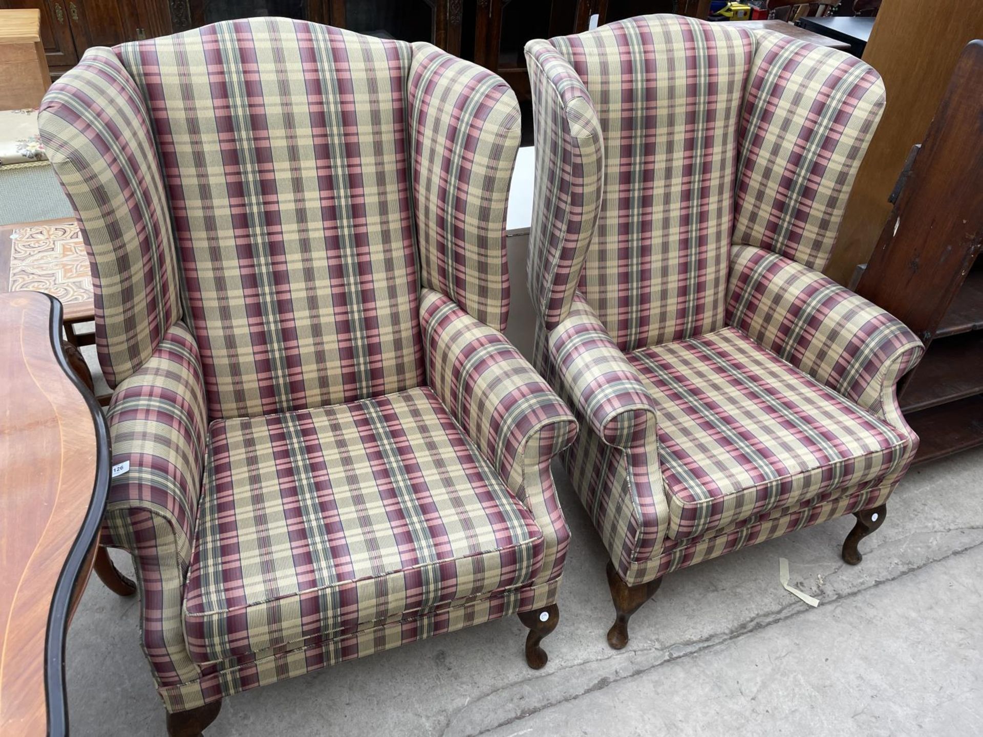 A PAIR OF WING BACK FIRESIDE CHAIRS ON FRONT CABRIOLE LEGS