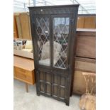 A GLAZED AND LEADED CORNER CUPBOARD