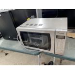 A SILVER PANASONIC MICROWAVE